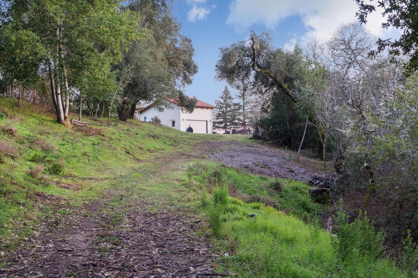 600 Ridge Top Road Los Gatos, CA 95033 - Photo 78 of 81 a view of a large yard with lots of green space and house