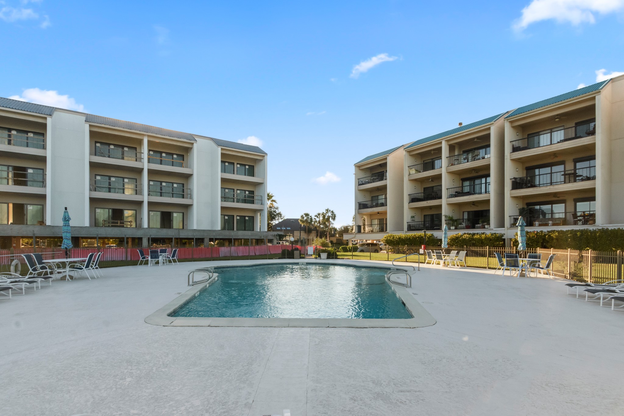 351 Lakeside Lane, Unit 305 Nassau Bay, TX 77058 - Photo 28 of 32 a view of a swimming pool with a lounge chair