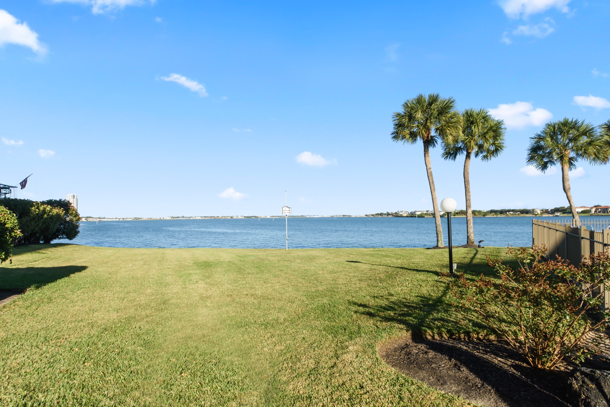 351 Lakeside Lane, Unit 305 Nassau Bay, TX 77058 - Photo 30 of 32 a view of an ocean beach and a swimming pool