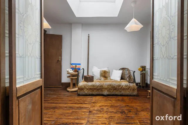 a living room with furniture and a rug