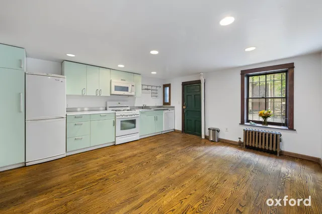 a kitchen with stainless steel appliances granite countertop a refrigerator sink and cabinets