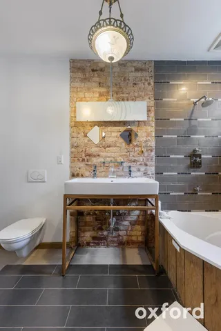 a living room with furniture a rug and a window