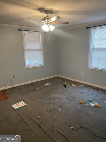 a view of a room with toys and chandelier