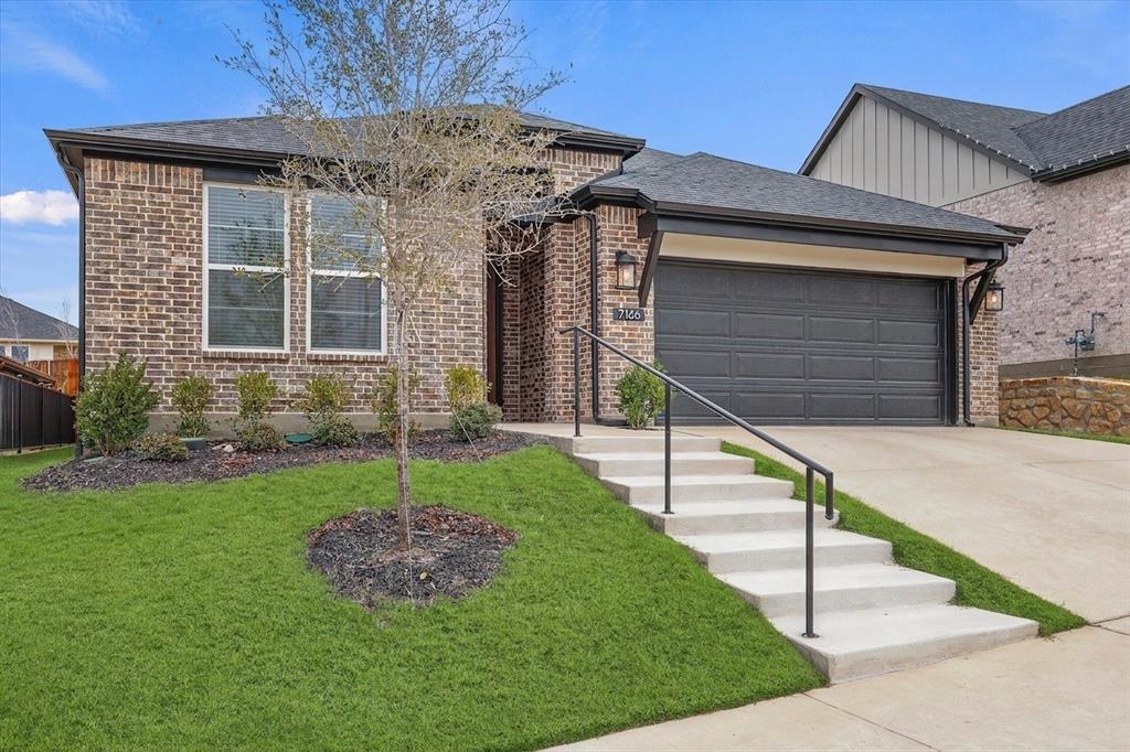 7136 Intrepid Drive Fort Worth, TX 76179 - Photo 2 of 31 a house with sign broad in front of it