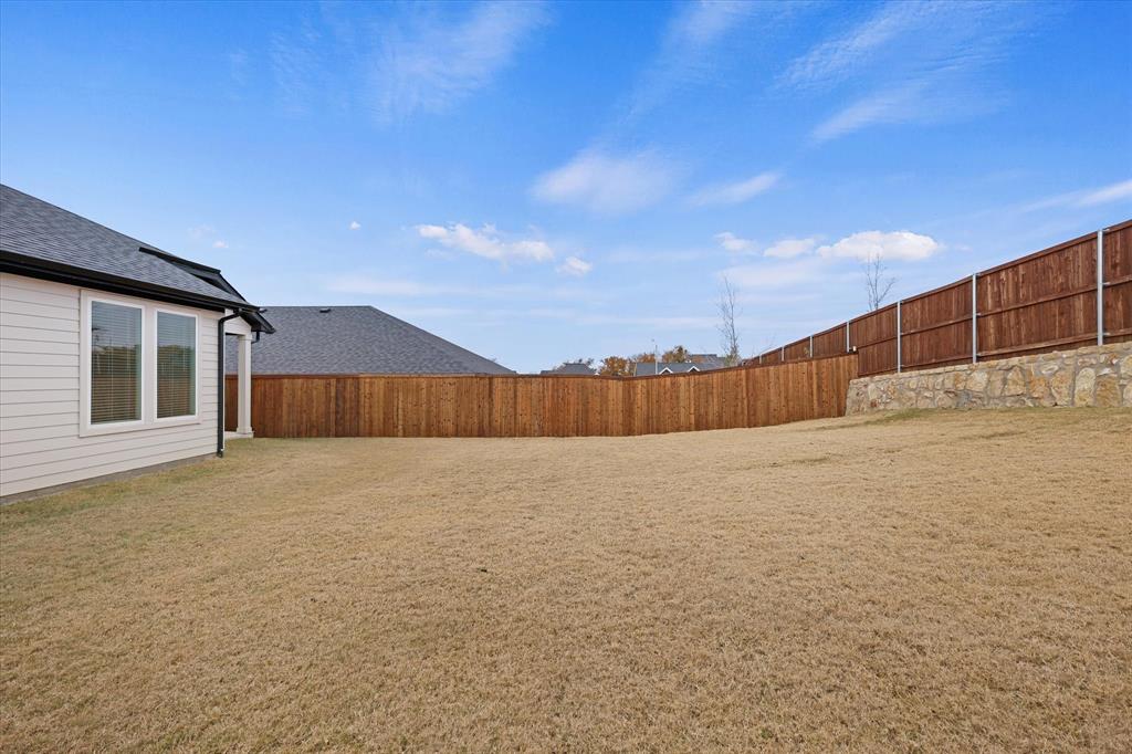 7136 Intrepid Drive Fort Worth, TX 76179 - Photo 25 of 30 a view of an empty room with wooden fence