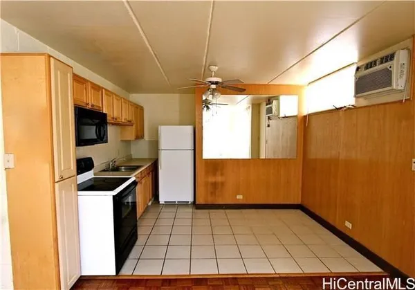 a kitchen with stainless steel appliances a refrigerator and a stove