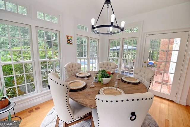 a living room with fireplace furniture and a wooden floor
