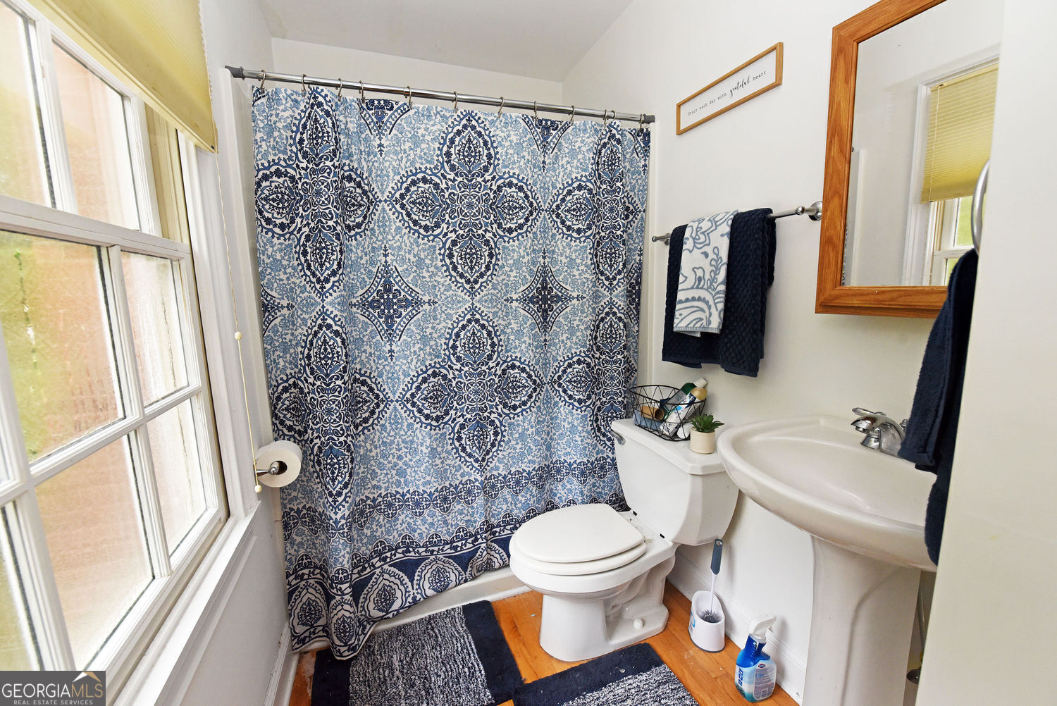 919 Deer Chase Toccoa, GA 30577 - Photo 32 of 62 a bathroom with a toilet sink and mirror