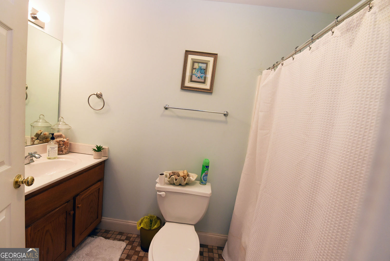 919 Deer Chase Toccoa, GA 30577 - Photo 35 of 62 a bathroom with a toilet sink and mirror