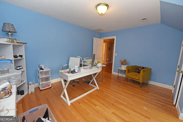 a view of a kitchen with a sink and a refrigerator