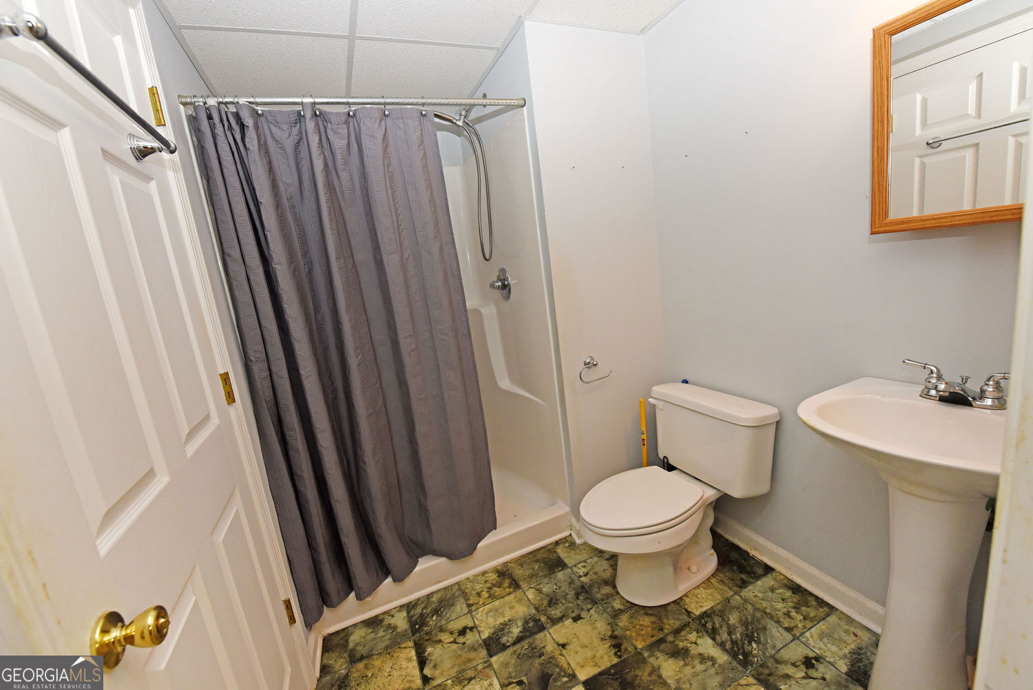 919 Deer Chase Toccoa, GA 30577 - Photo 49 of 62 a bathroom with a toilet and a shower curtain
