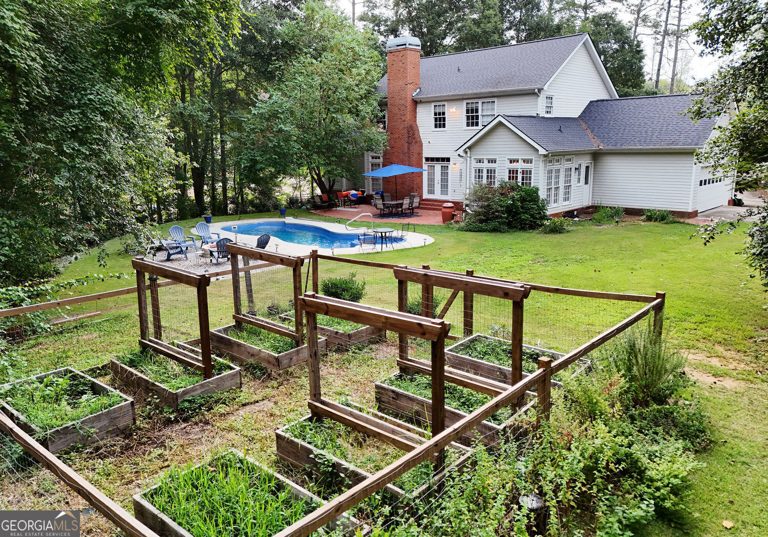 919 Deer Chase Toccoa, GA 30577 - Photo 57 of 62 a view of house with garden space and sitting area