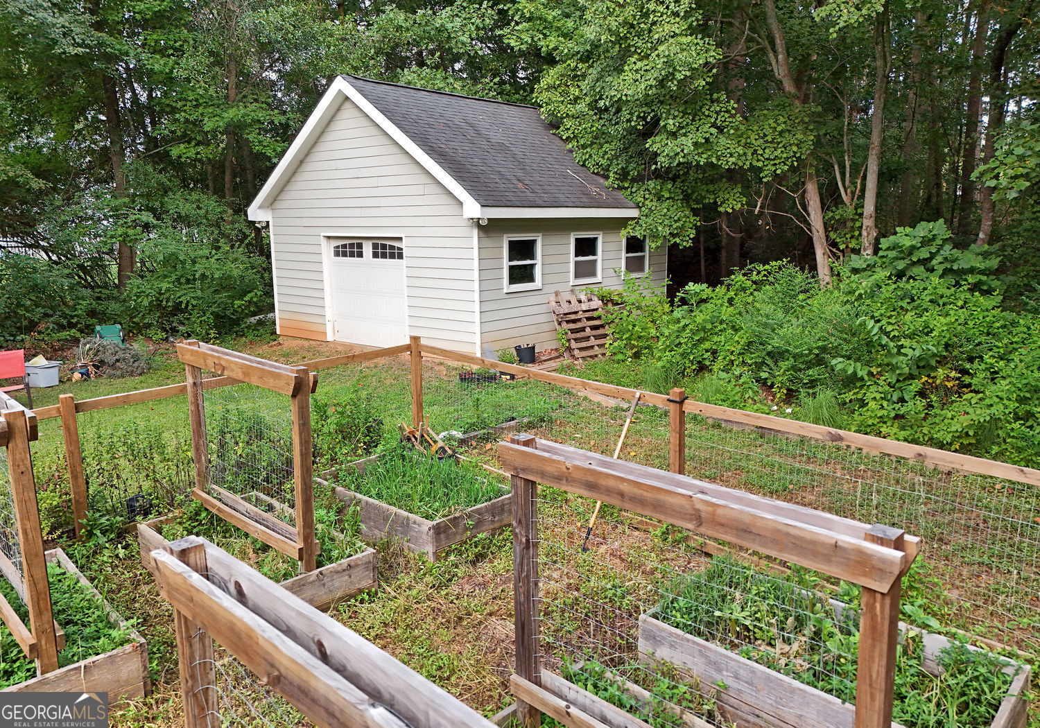 919 Deer Chase Toccoa, GA 30577 - Photo 62 of 62 a house view with a garden and outdoor seating