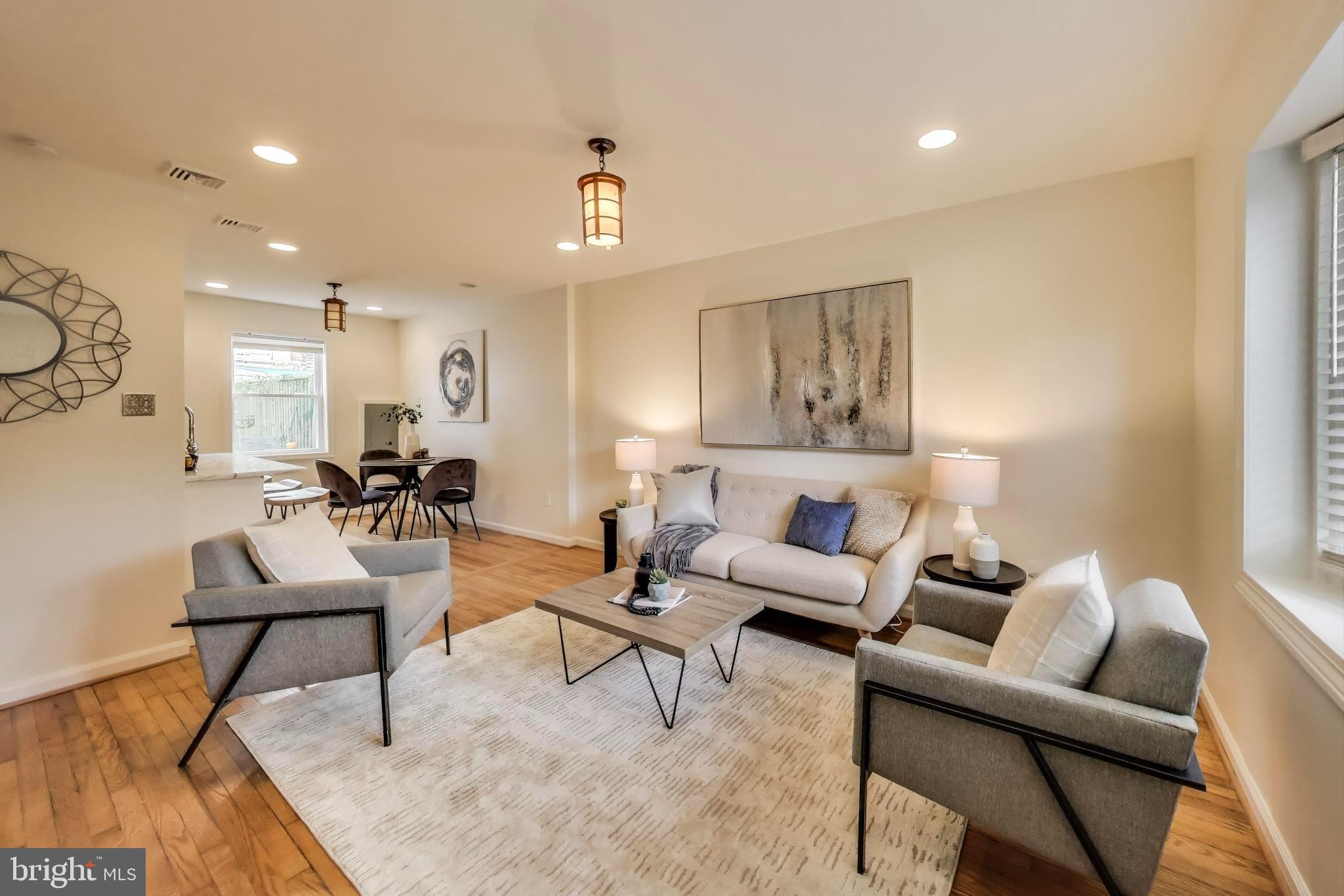 a living room with furniture and a table
