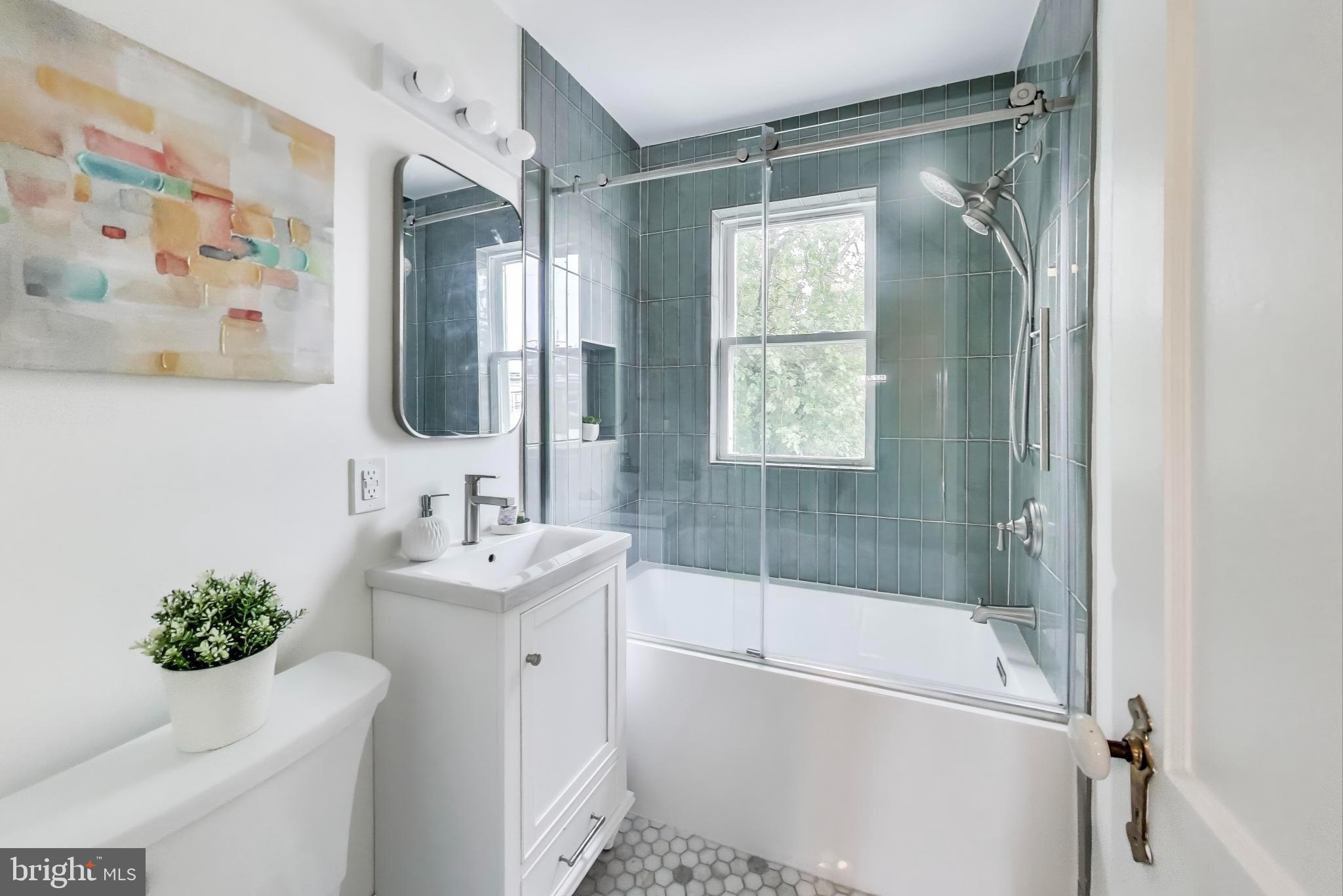 3357 Clay Place Northeast Washington, DC 20019 - Photo 11 of 16 a bathroom with a sink toilet and shower