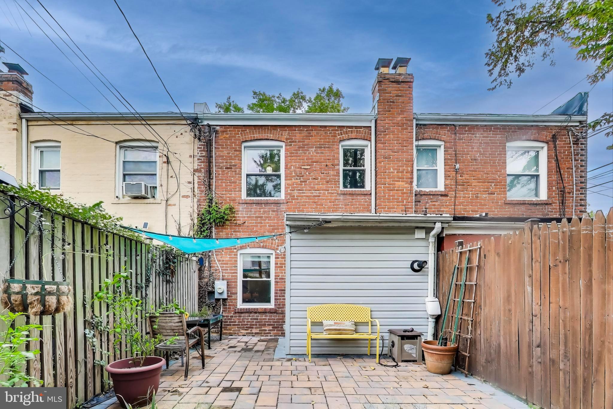 3357 Clay Place Northeast Washington, DC 20019 - Photo 12 of 16 a view of a patio with table and chairs and potted plants