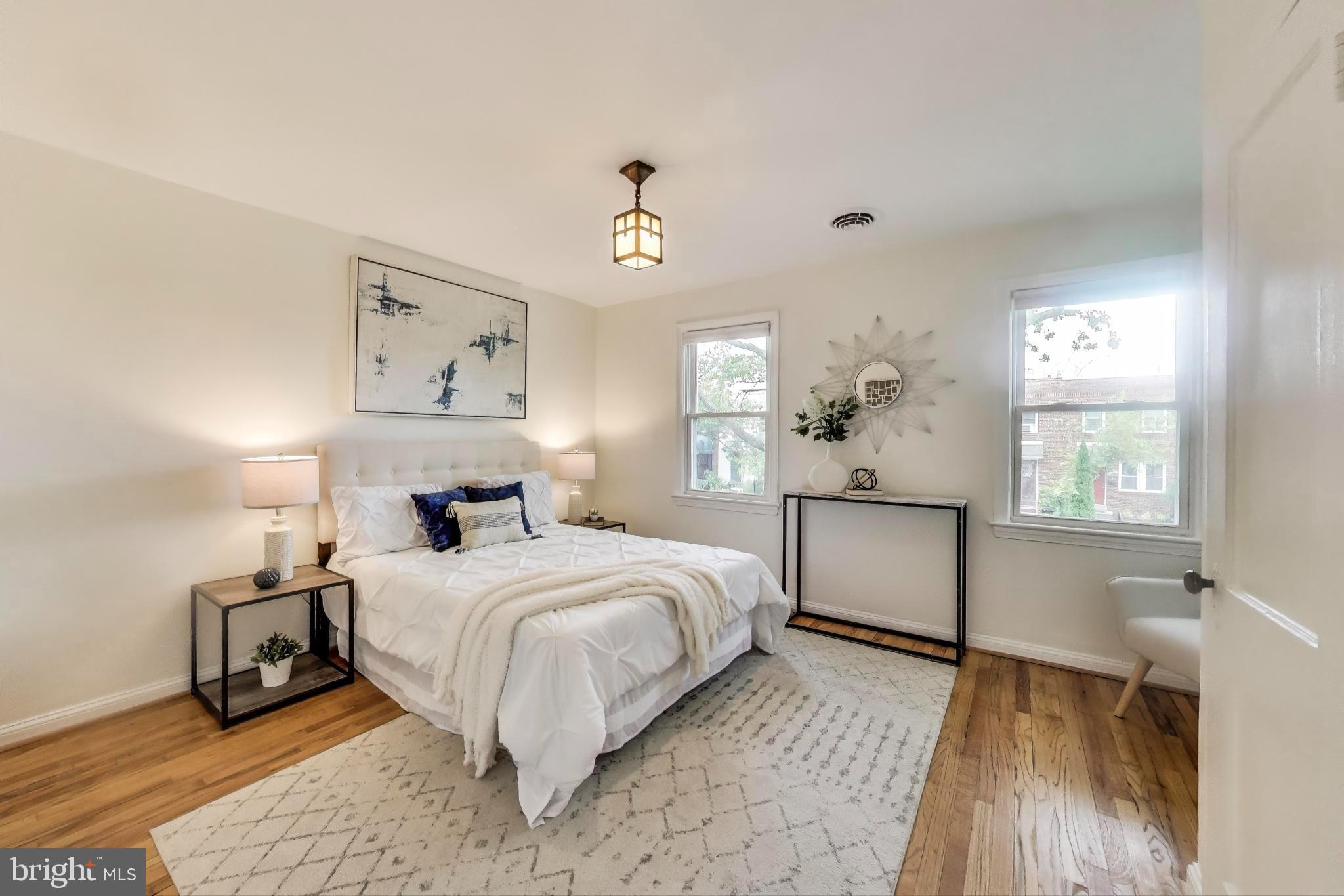 3357 Clay Place Northeast Washington, DC 20019 - Photo 7 of 16 a bedroom with a bed and wooden floor