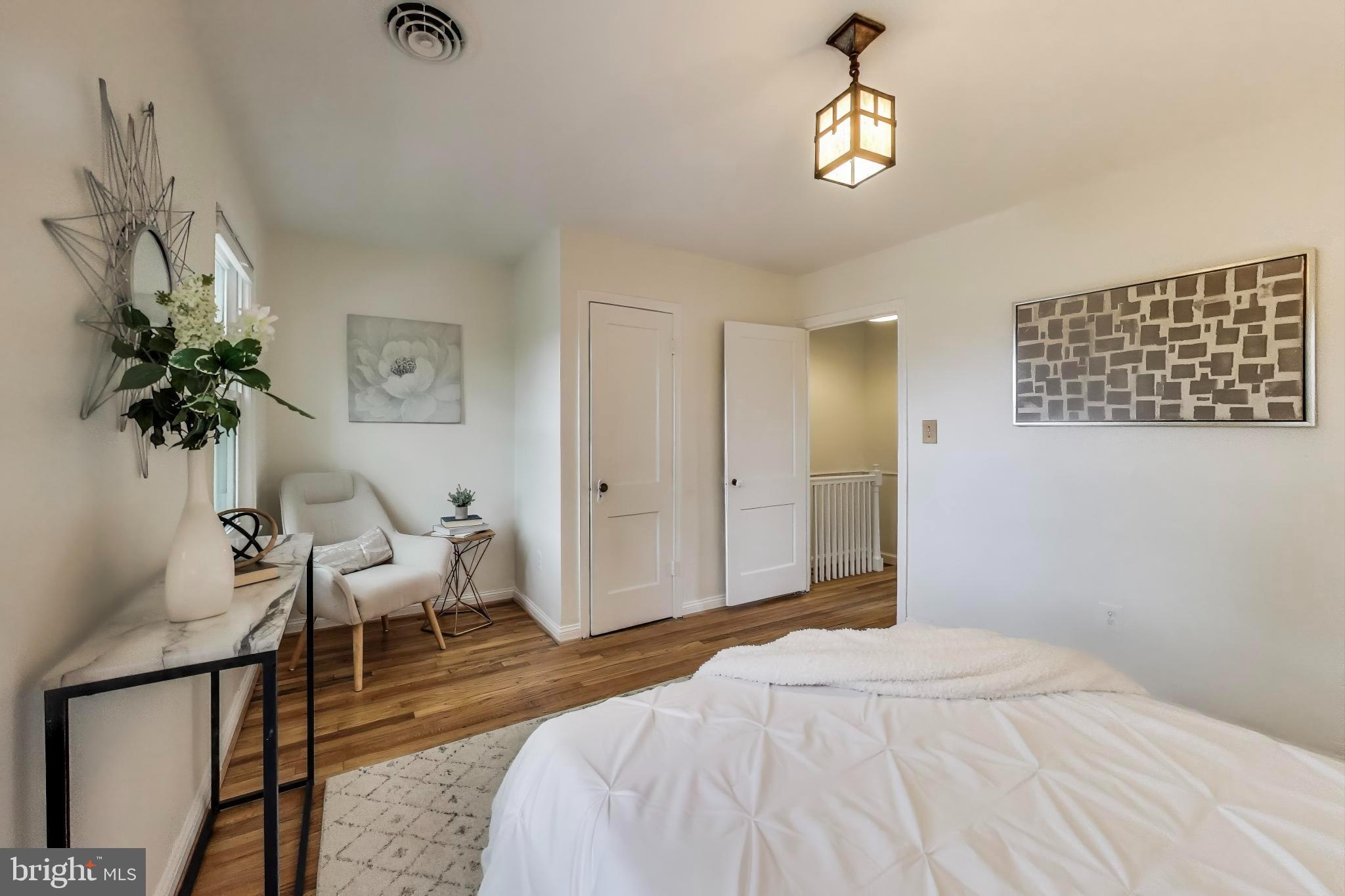 3357 Clay Place Northeast Washington, DC 20019 - Photo 8 of 16 a bedroom with a bed and a chandelier