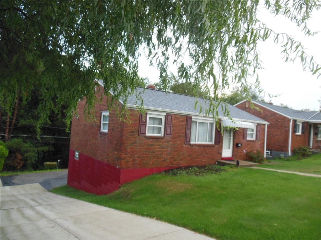 166 Castle Road Pittsburgh, PA 15234 - Photo 2 of 14 a front view of house with yard and green space