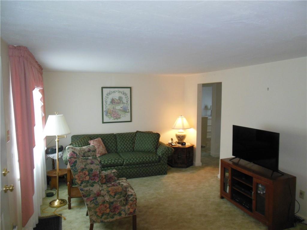 166 Castle Road Pittsburgh, PA 15234 - Photo 4 of 14 a living room with furniture and a flat screen tv