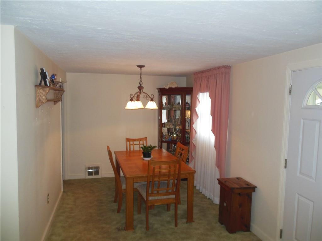 166 Castle Road Pittsburgh, PA 15234 - Photo 5 of 14 a view of a dining room with furniture and chandelier