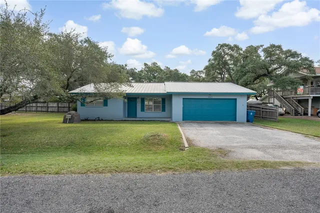 a front view of house with yard and entertaining space