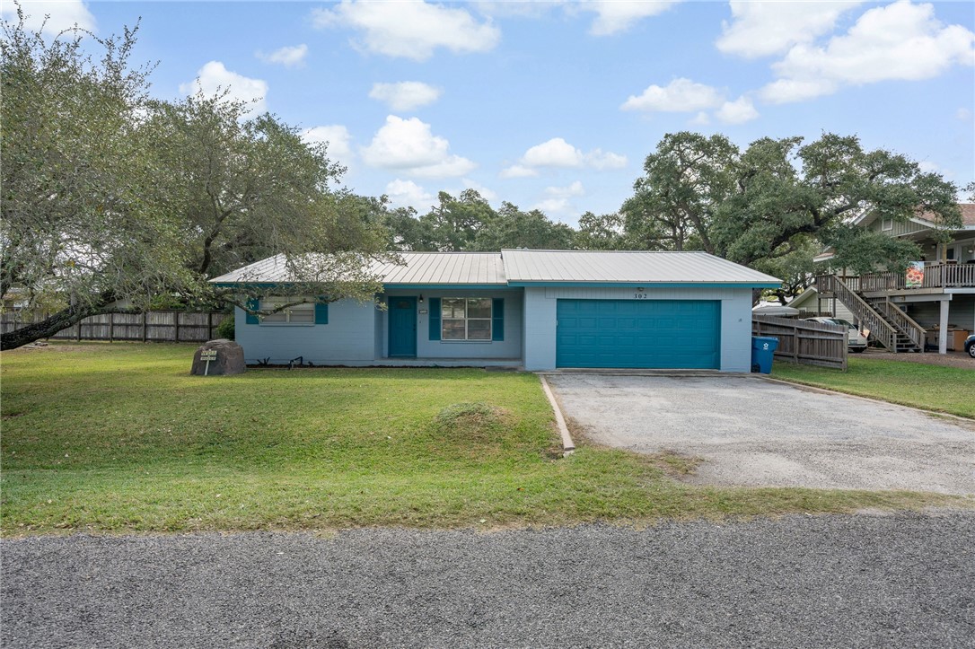 a front view of house with yard and entertaining space