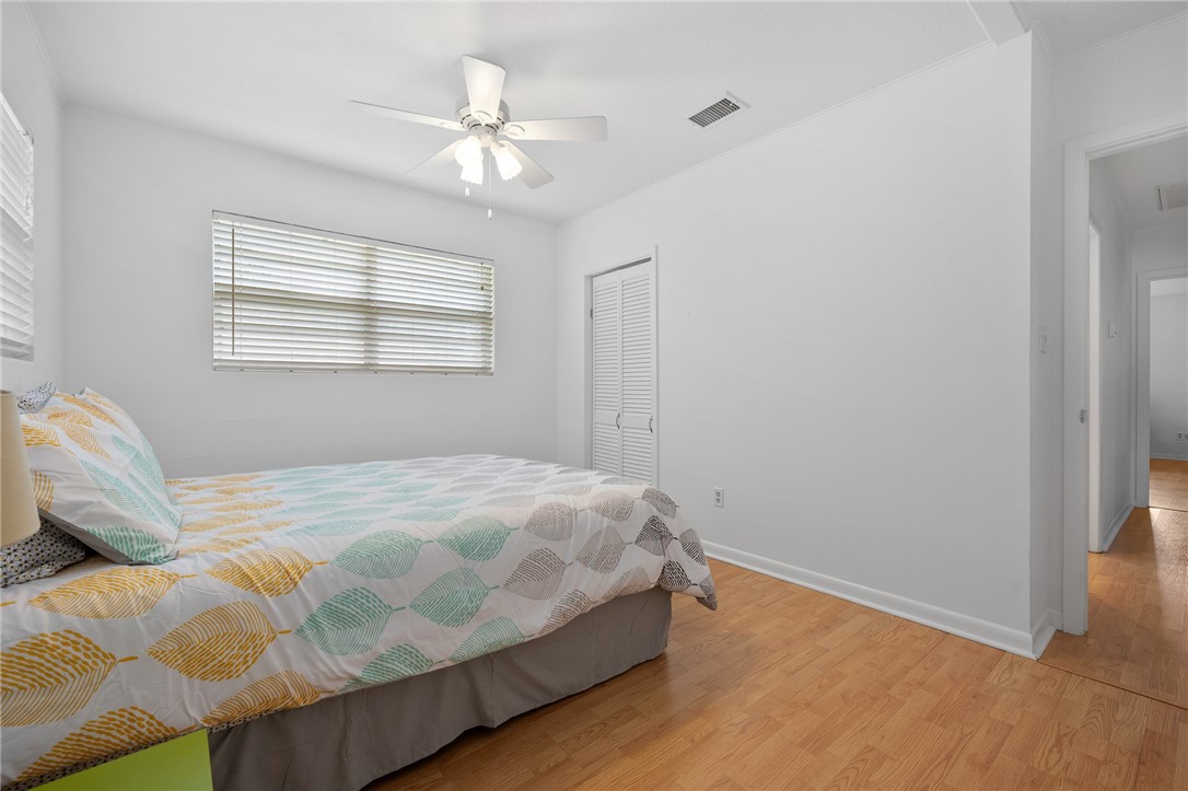 302 Fulton Avenue Rockport, TX 78382 - Photo 22 of 34 a bedroom with a bed and window
