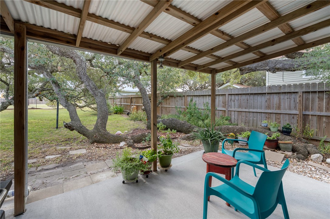 302 Fulton Avenue Rockport, TX 78382 - Photo 23 of 34 a backyard of a house with table and chairs