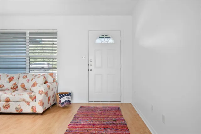 a view of a bedroom with window and couch