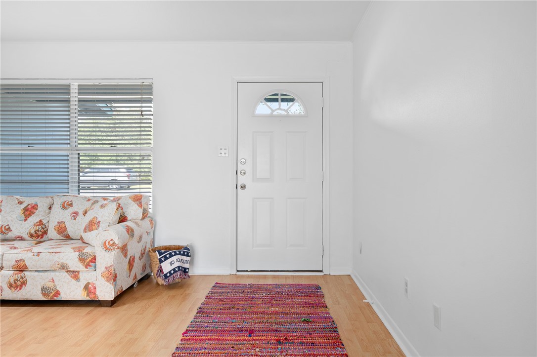 302 Fulton Avenue Rockport, TX 78382 - Photo 4 of 34 a view of a bedroom with window and couch