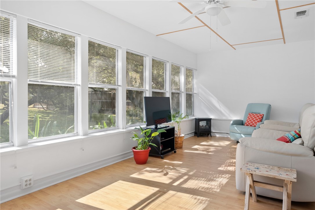 302 Fulton Avenue Rockport, TX 78382 - Photo 9 of 34 a living room with furniture and a potted plant