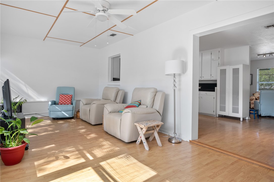 302 Fulton Avenue Rockport, TX 78382 - Photo 10 of 34 a living room with furniture and a potted plant