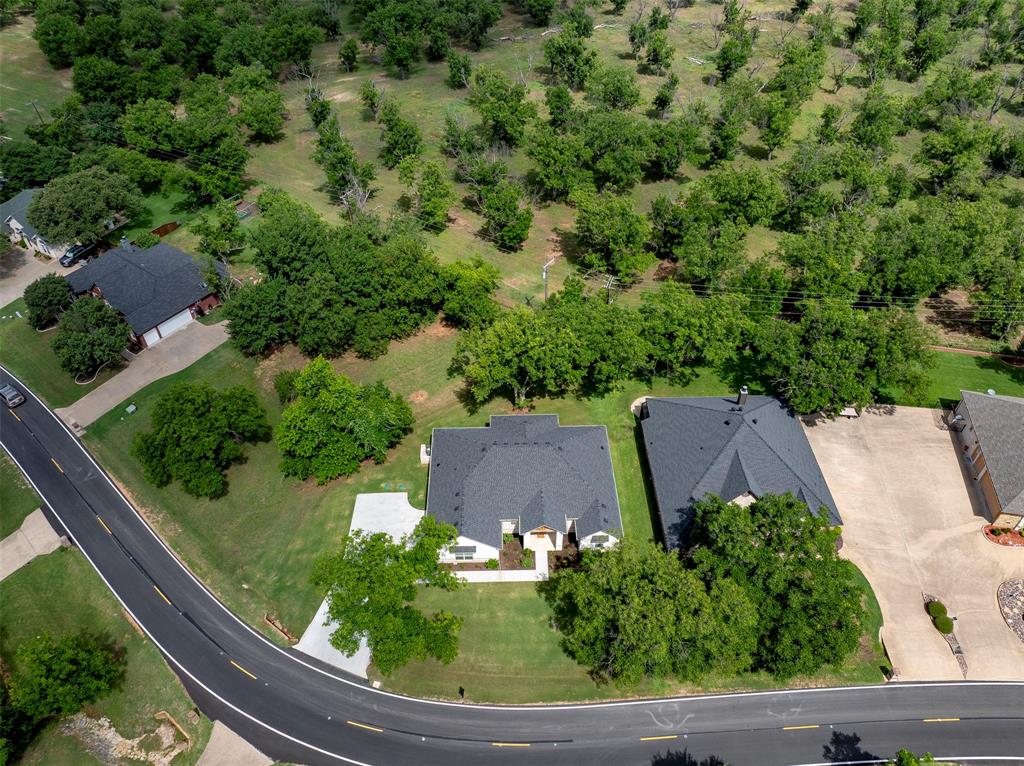 10301 Ravenswood Road Granbury, TX 76049 - Photo 2 of 38 Home backs up to pecan orchard