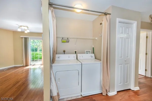 a view of bathroom with washer and dryer