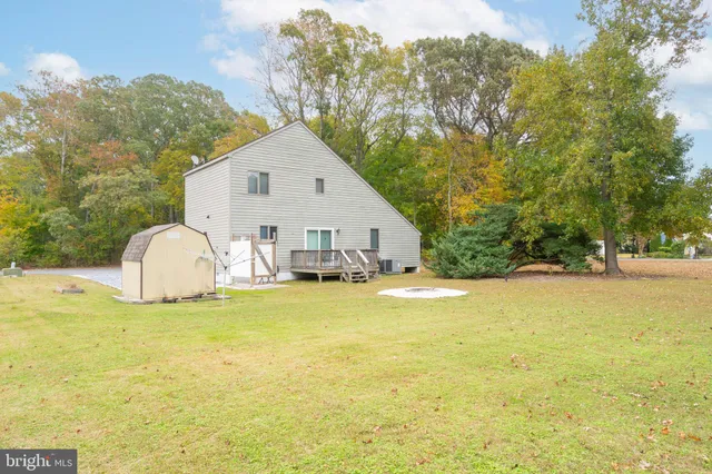 a view of a house with swimming pool and sitting area