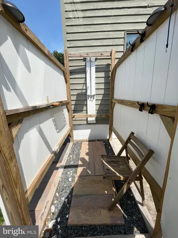 a view of a swimming pool with an outdoor space and seating area