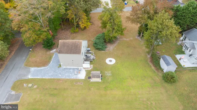 a view of a swimming pool with a yard