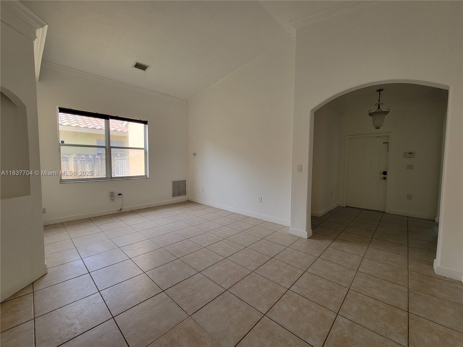 Miramar Patio Homes Miramar, FL 33027 - Photo 15 of 43 an empty room with windows