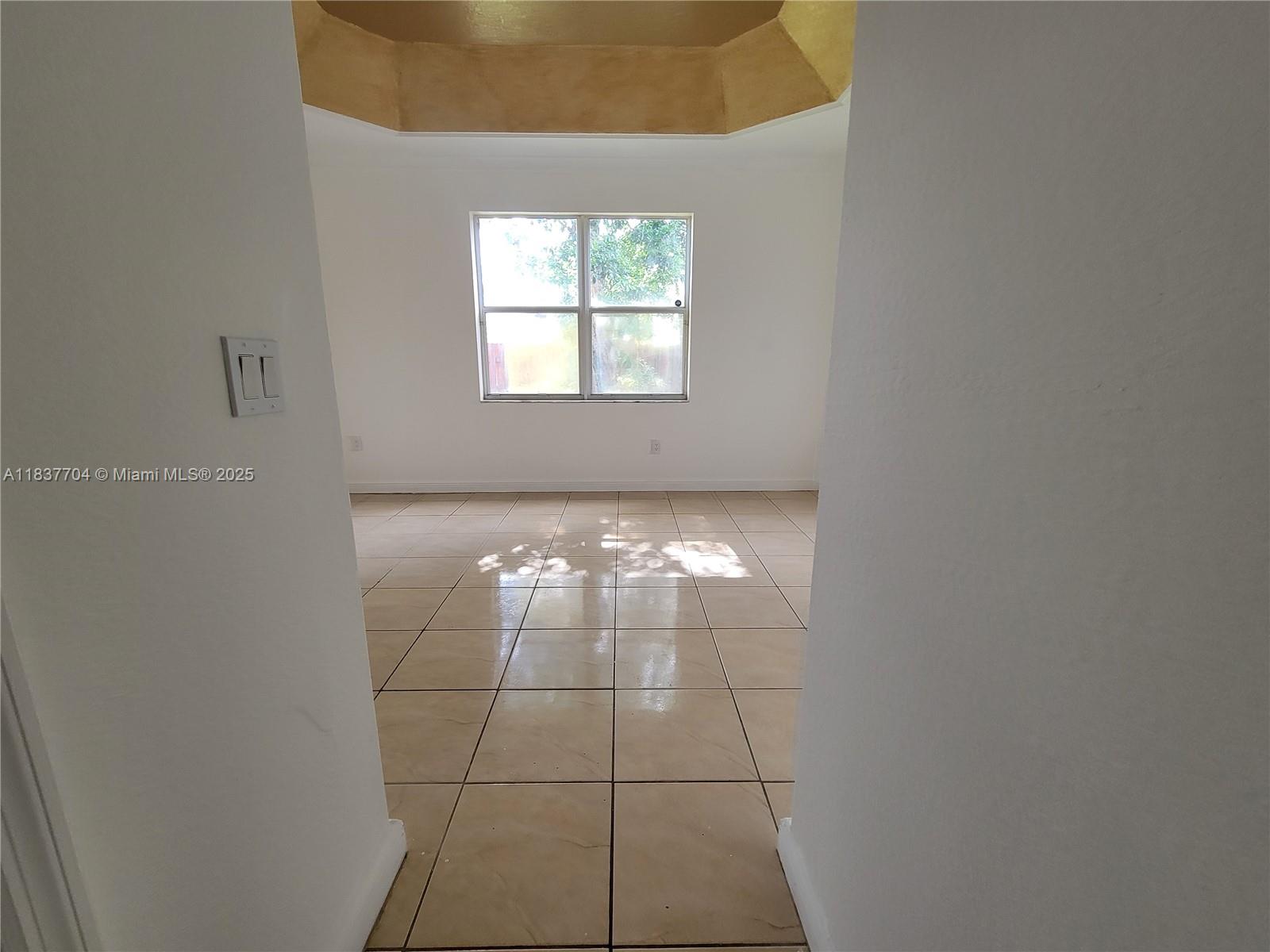 Miramar Patio Homes Miramar, FL 33027 - Photo 32 of 43 an empty room with windows