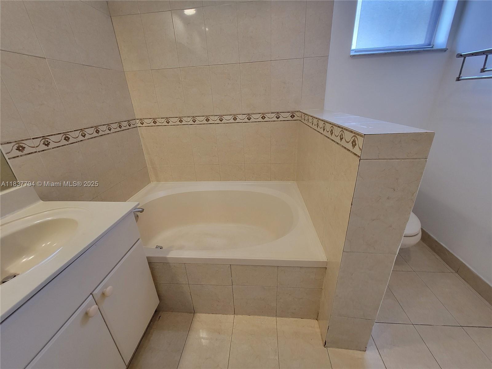 Miramar Patio Homes Miramar, FL 33027 - Photo 35 of 43 a bathroom with a shower