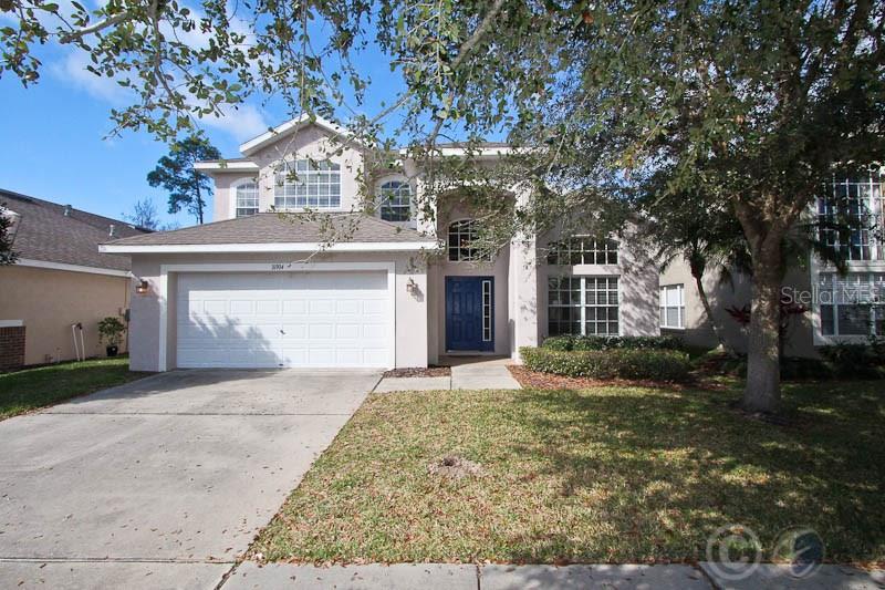 16904 Hawkridge Road Lithia, FL 33547 - Photo 1 of 1 a front view of a house with a yard and garage