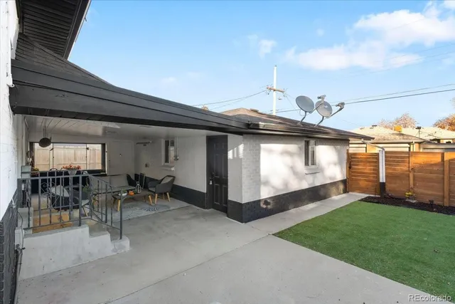 a view of a porch with furniture and garden