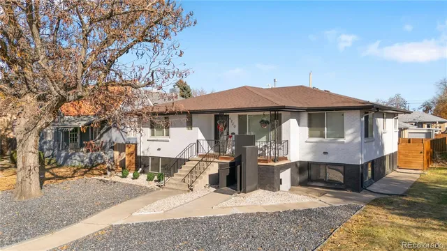 a front view of a house with a yard patio and fire pit