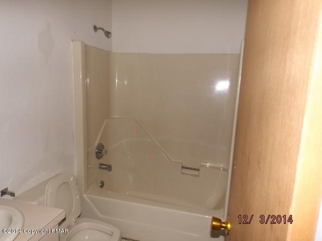 833 Canterbury Road Bushkill, PA 18324 - Photo 9 of 9 a bathroom with a bathtub and shower