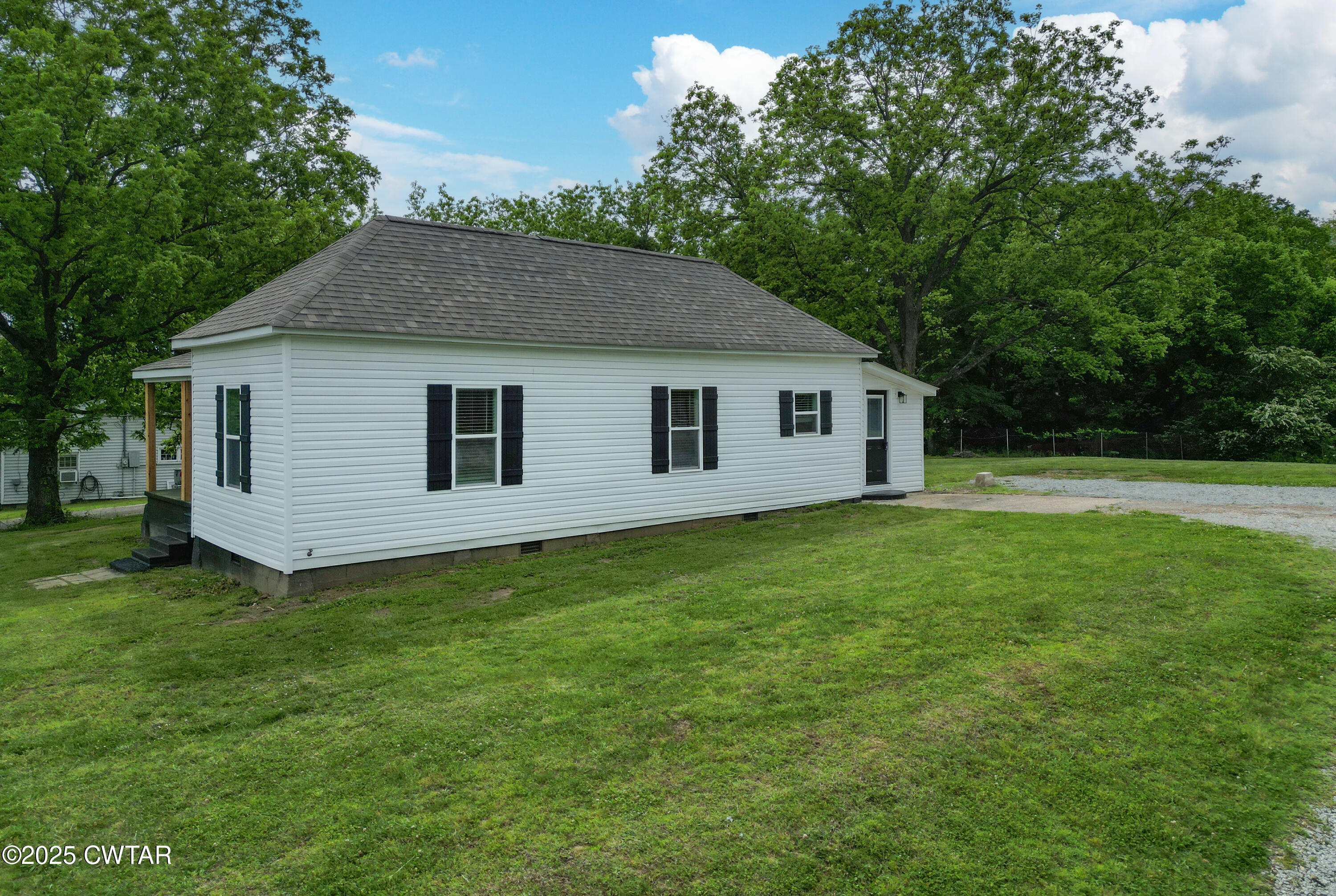 127 Franklin Street Gadsden, TN 38337 - Photo 2 of 12 a view of a backyard with a garden