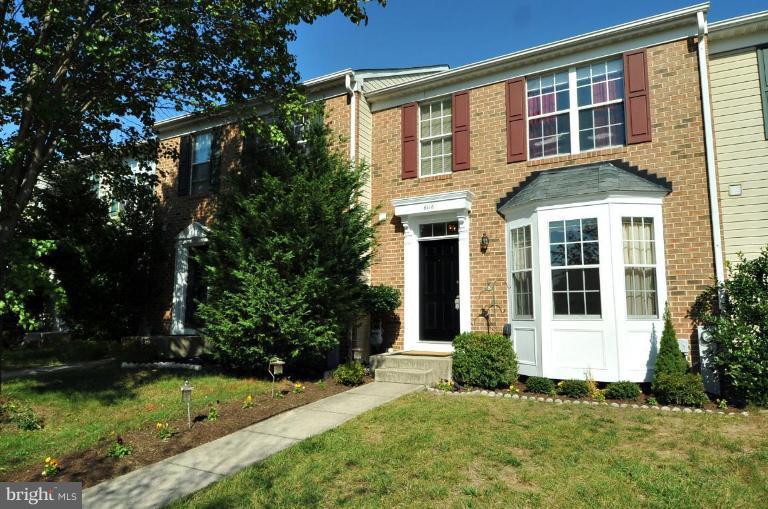 6116 Starburn Path Columbia, MD 21045 - Photo 1 of 18 a front view of a house with a yard