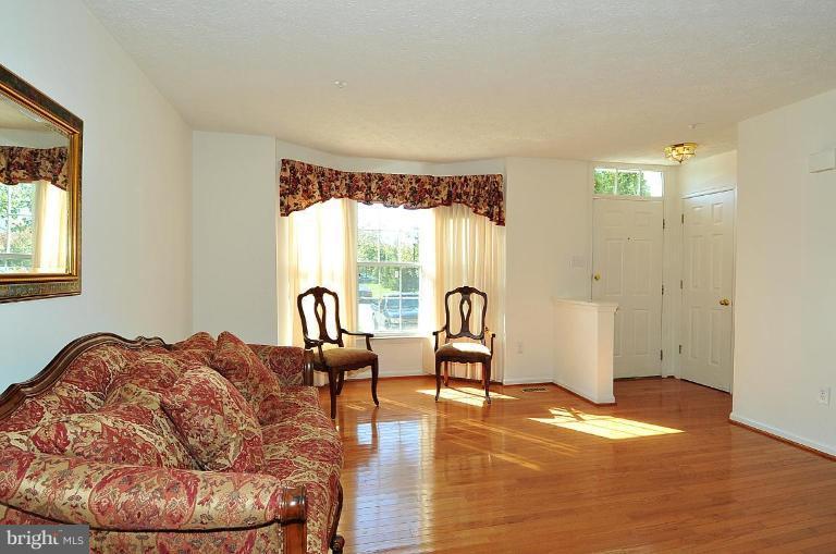 6116 Starburn Path Columbia, MD 21045 - Photo 2 of 18 a living room with furniture and a window
