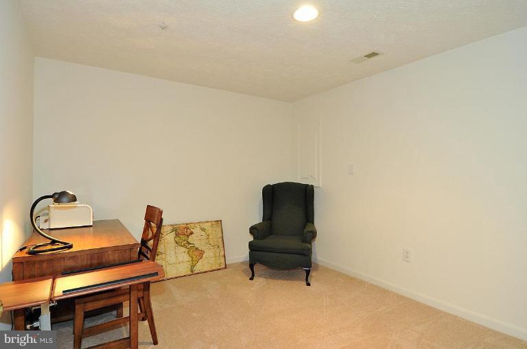6116 Starburn Path Columbia, MD 21045 - Photo 11 of 18 a living room with furniture and piano