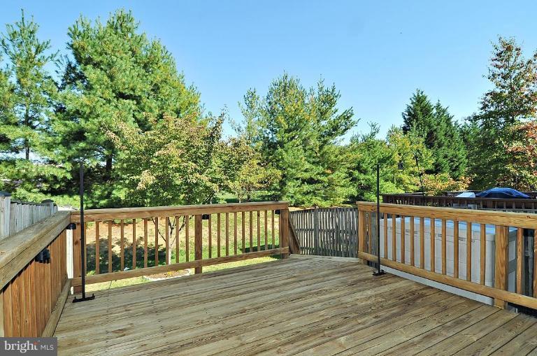 6116 Starburn Path Columbia, MD 21045 - Photo 12 of 18 a view of deck with wooden floor and fence